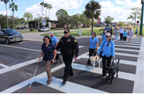 White Cane Day in Orlando group in crosswalk some in night shades